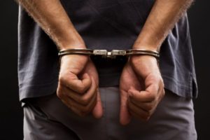 depositphotos_28098513-stock-photo-close-up-arrested-man-handcuffed